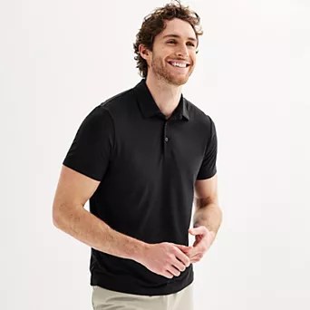 Close-up of Flx clothing apparel details including embroidered logo and performance fabric texture